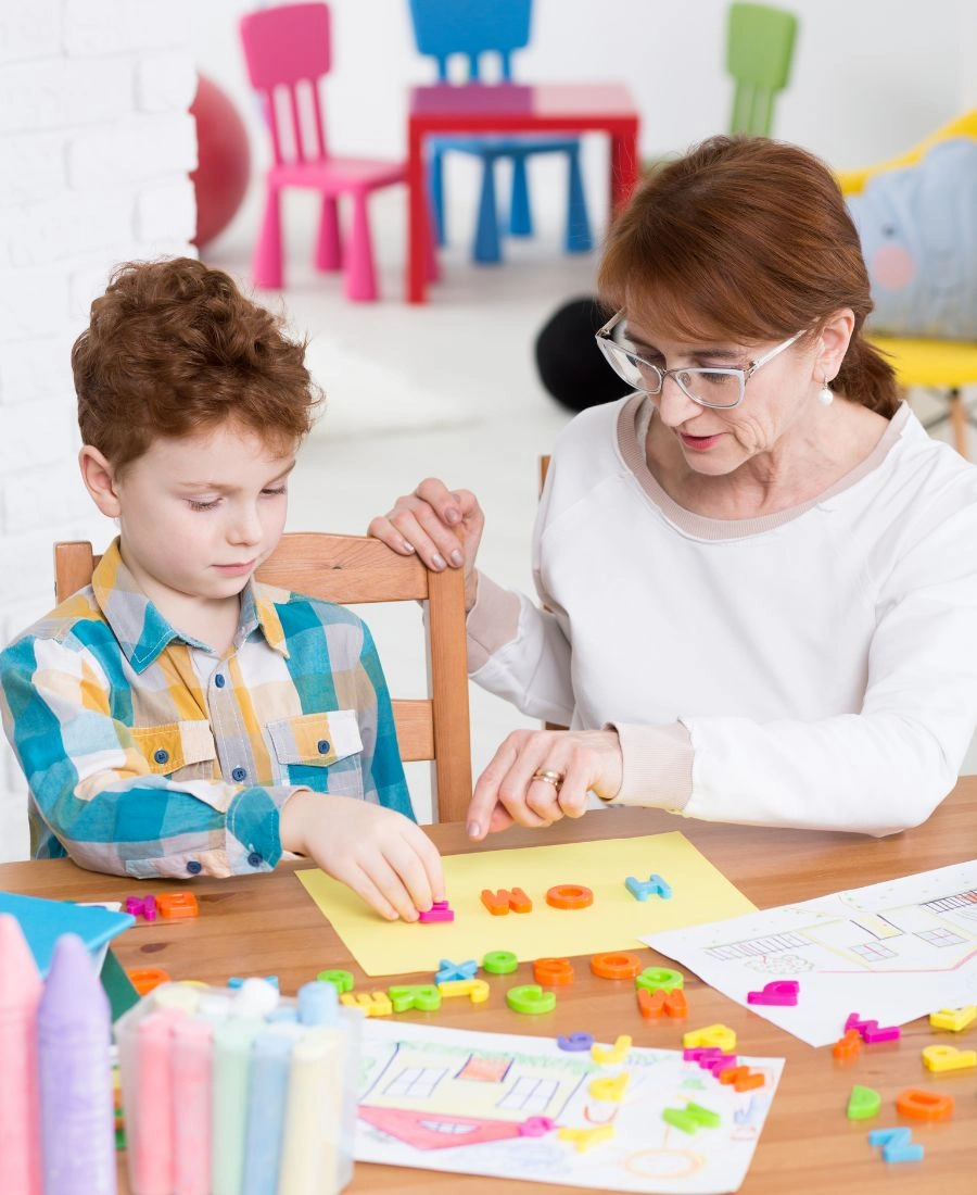 Therapist working with a child at eMind Autism Center Multan